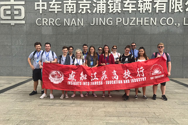 Students posted for a picture at CRRC Nanjing Puzhen Co., Ltd